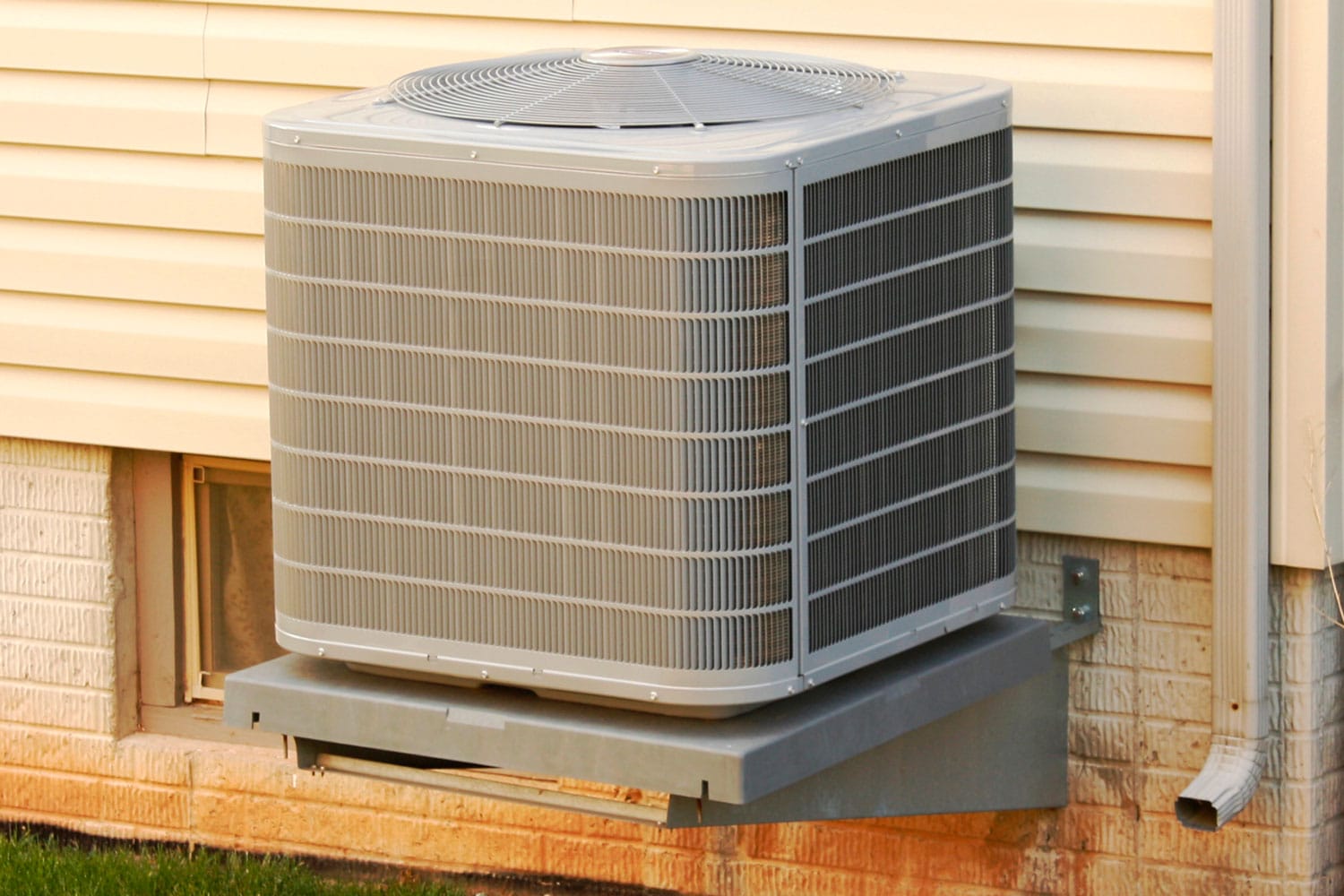 A small air conditioning unit mounted on an elevated stand