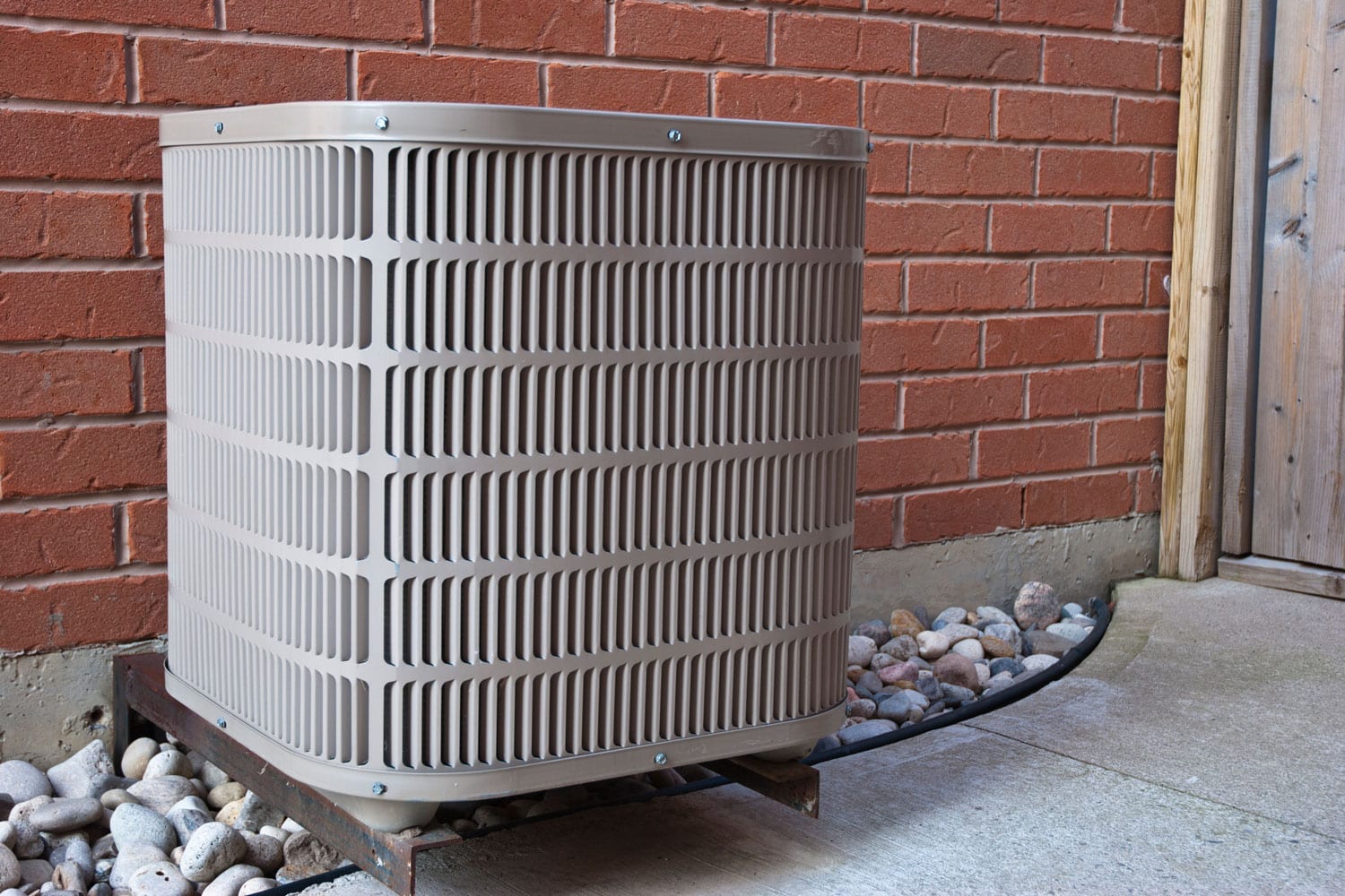 A small high powered air conditioning unit mounted on a metal stand