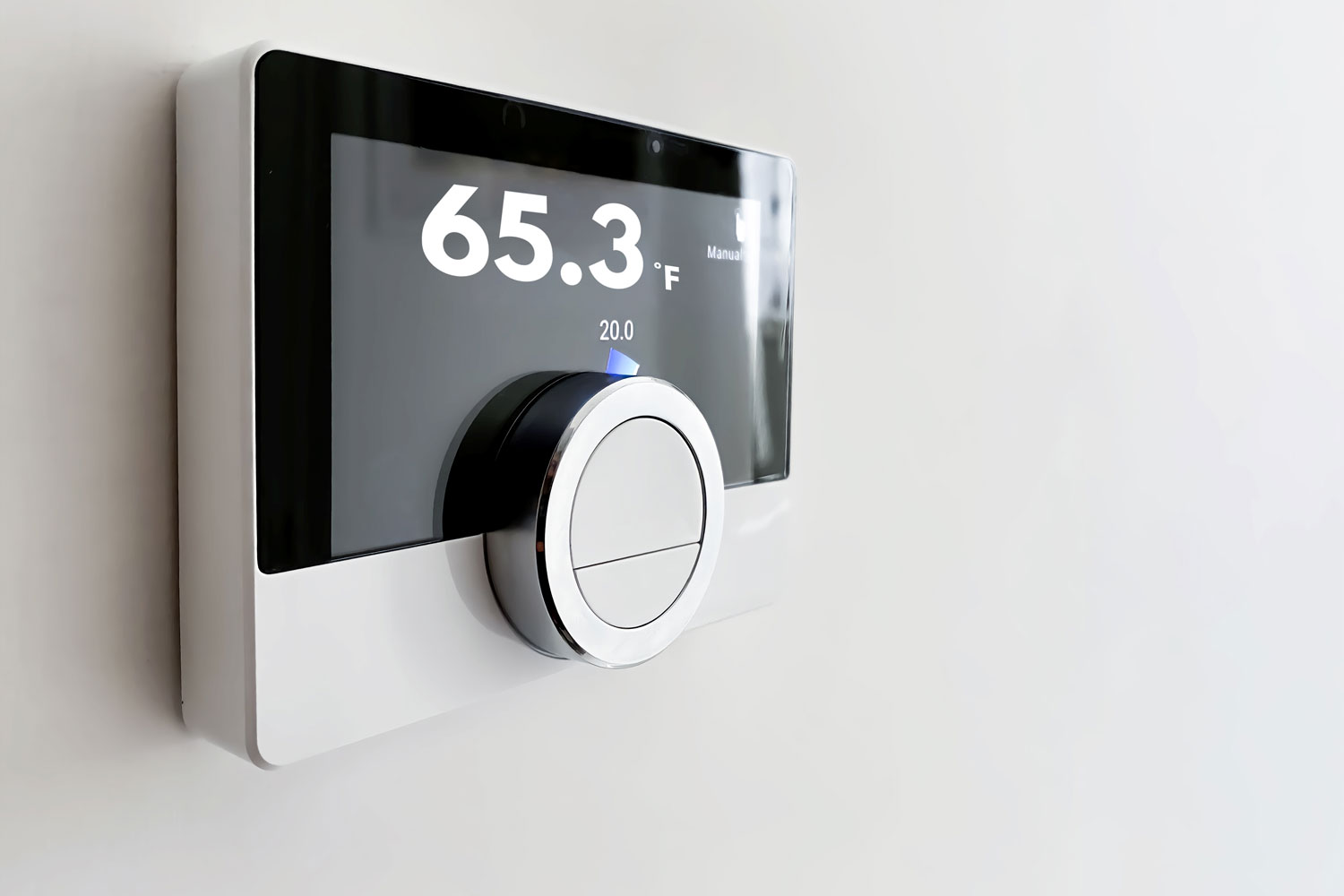 A thermostat set to 65.3 degrees FahrenheiT