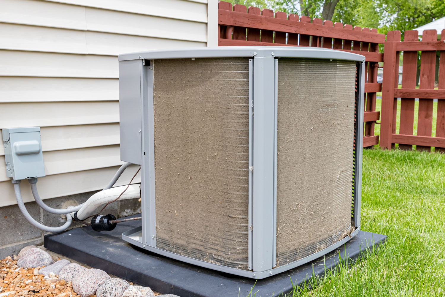 An extremely dirty air conditioning condenser