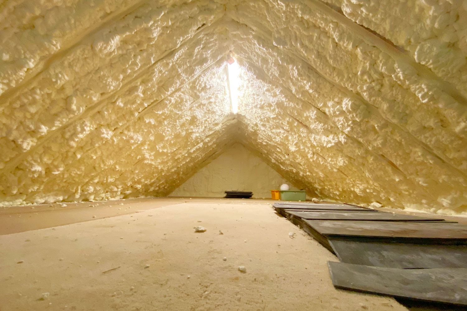 Hardened spray foam insulation in the attic