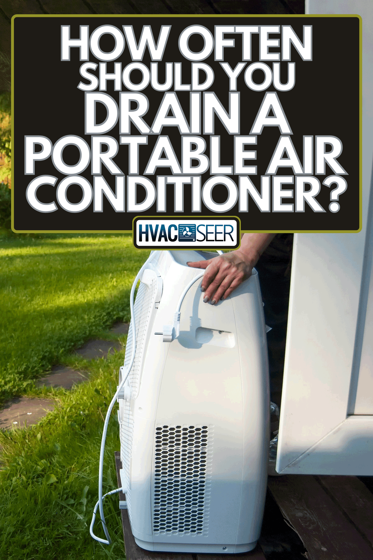 Hands moving a portable air conditioner into a house, How Often Should You Drain A Portable Air Conditioner?