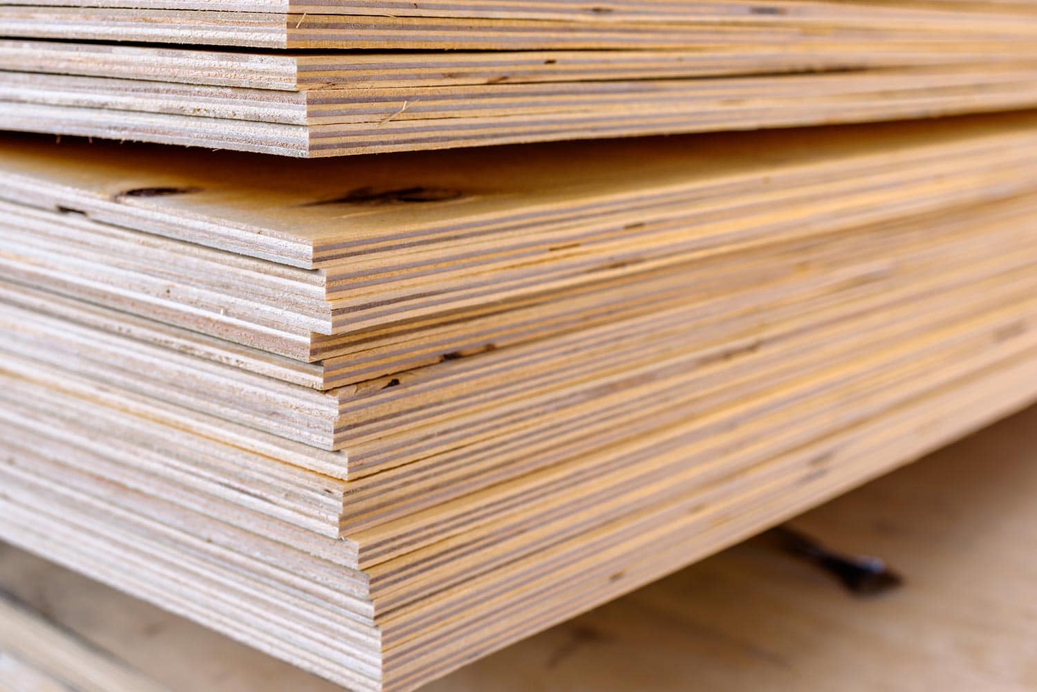 Sheets of stacked plywood in lumberyard