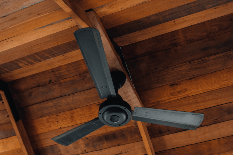 black-painted-ceiling-fan-indoors-under-wooden-ceiling.-Lost-Ceiling-Fan-Remote---What-To-Do