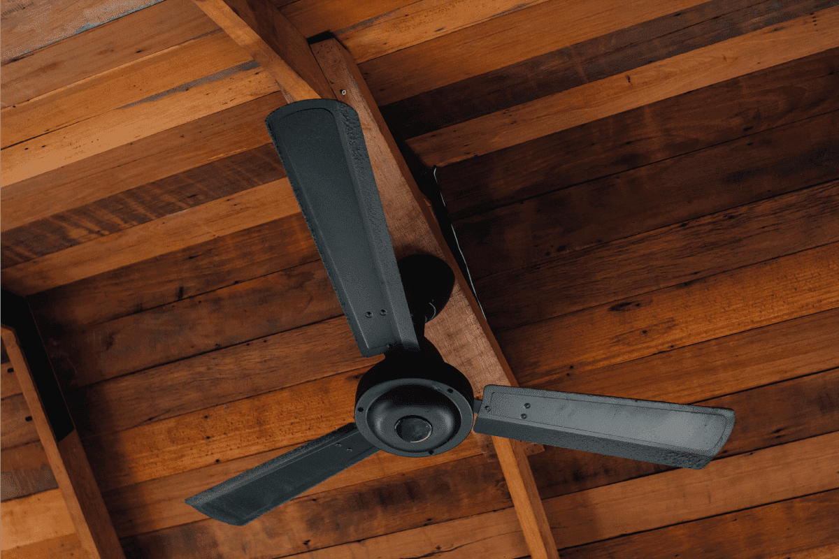 black painted ceiling fan indoors under wooden ceiling. Lost Ceiling Fan Remote - What To Do