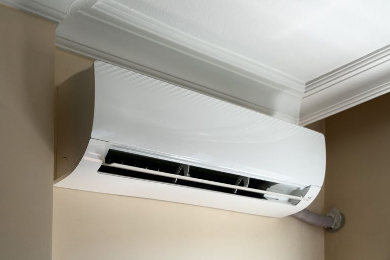 mini split air conditioner system on wall background, Can You Put A Mini Split Condenser In The Attic?