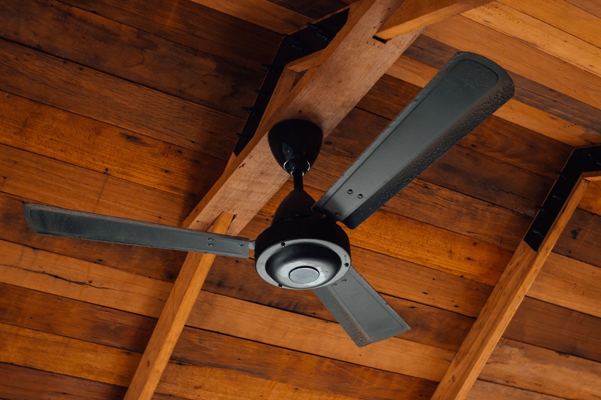 Ceiling fan in attached in a wood type ceiling 