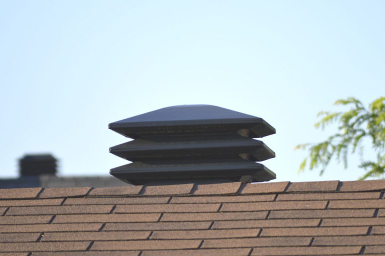 2 roof vents, one in the distance, front focus. Showing proper ventilation of attics, How Many Roof Vents Do I Need?