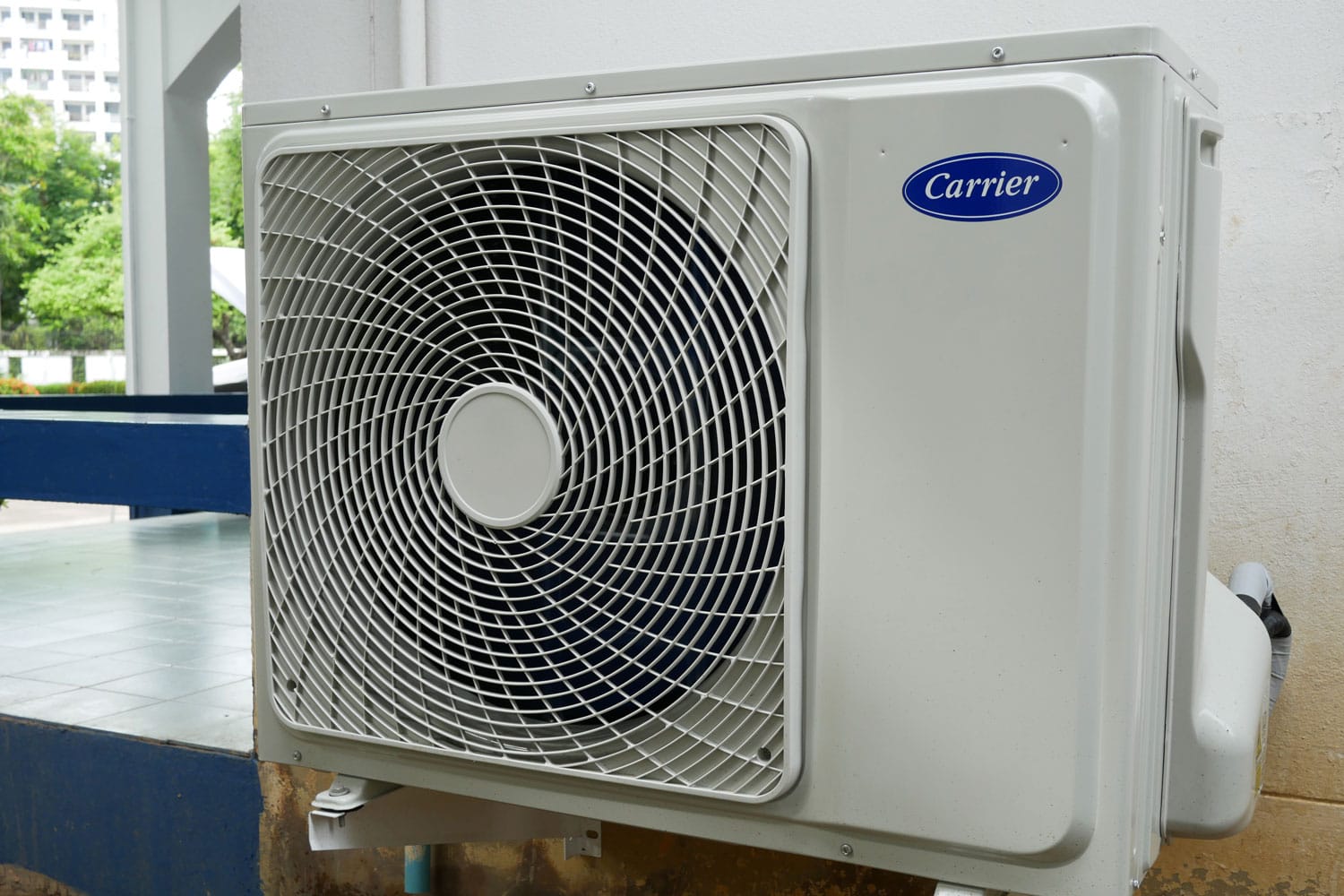 A big Carrier air conditioning unit mounted on reinforced metal brackets, Carrier AC Fan Won't Shut Off—What's Wrong? 