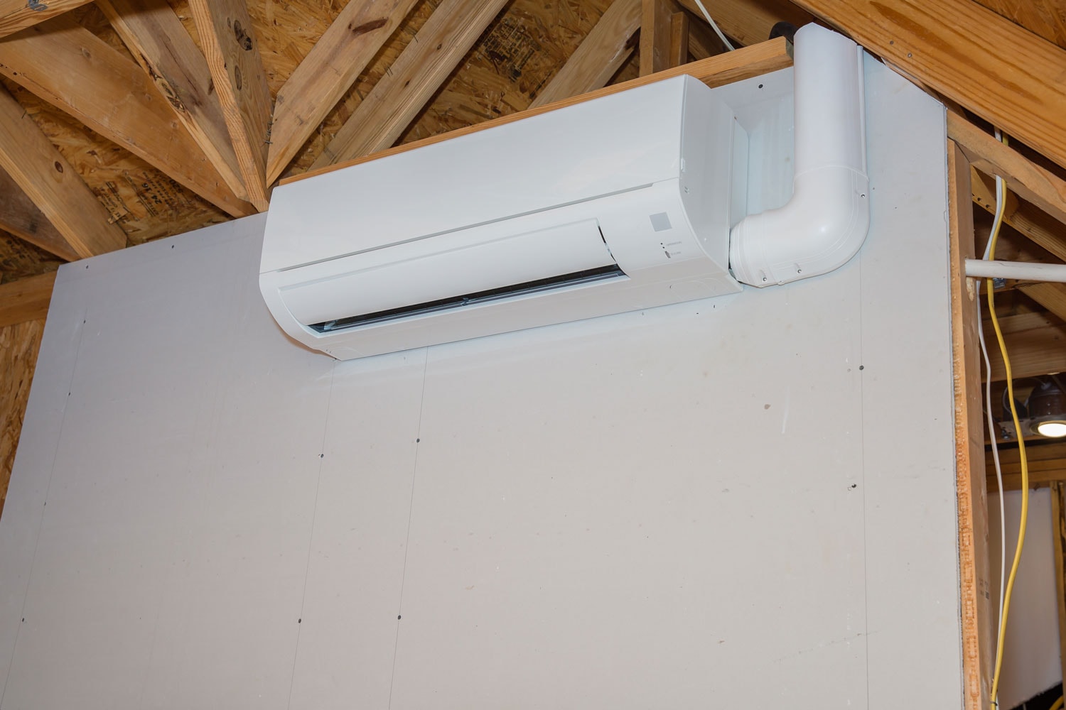 A ductless mini split AC unit mounted on the wall