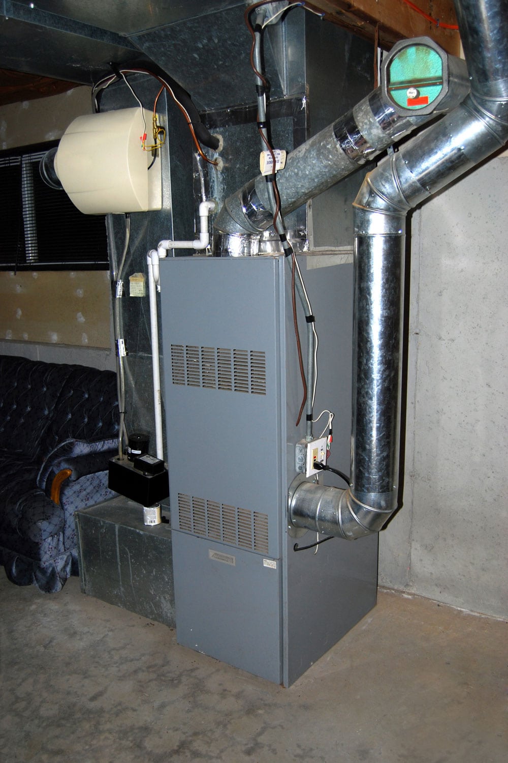 A gray furnace inside the basement