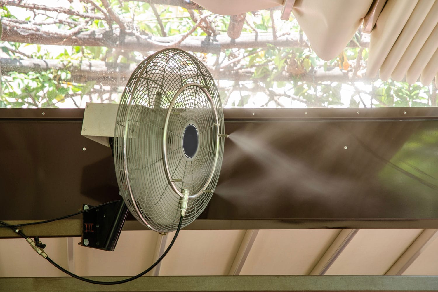 A misting fan turned on inside a room