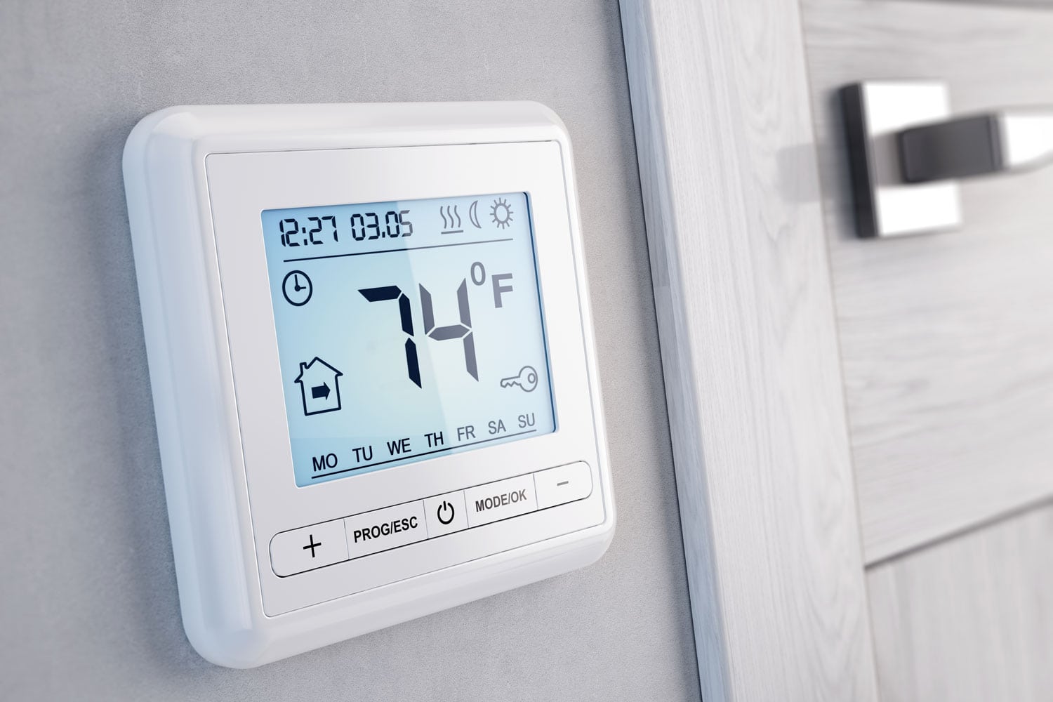 A thermostat set to 74 degrees