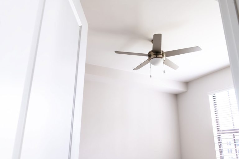 A white ceiling fan installed inside a bedroom, How To Increase Ceiling Fan Speed