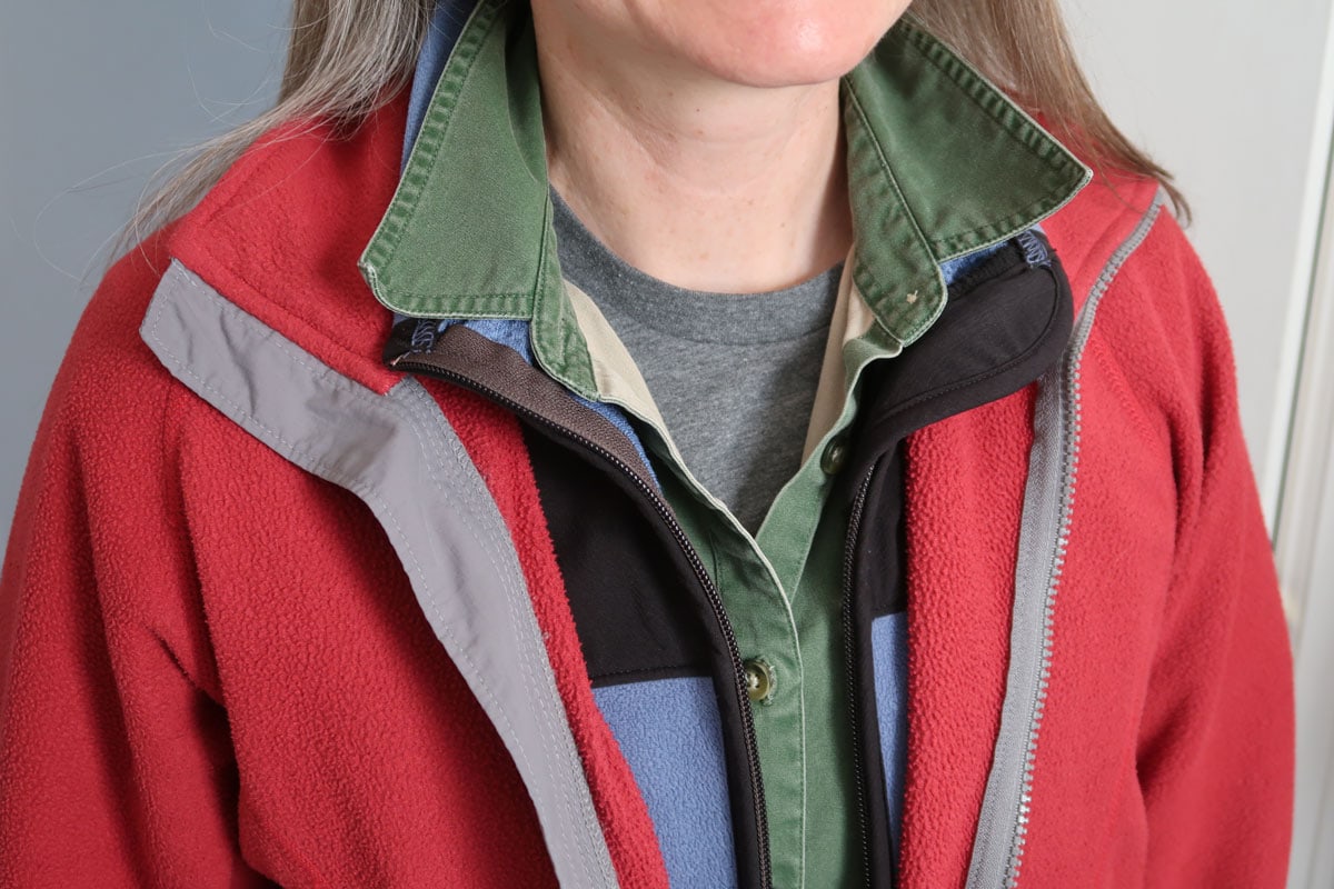 A woman wears many layers of clothing. Layering is a good strategy for frequent temperature changes.