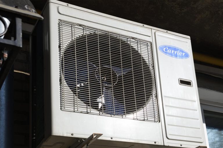 An air conditioning outside the building, Does A Carrier AC Need A Stabilizer?
