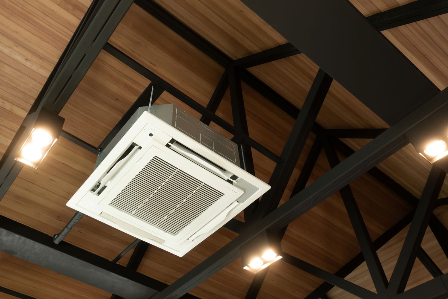 An AC unit mounted on reinforce metal ceiling framing