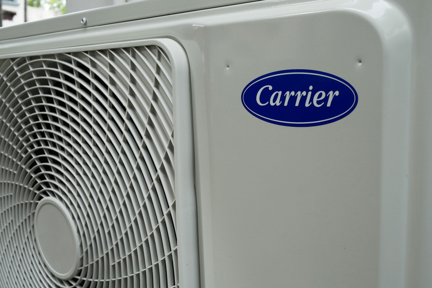An up closed photo of a Carrier air conditioning unit