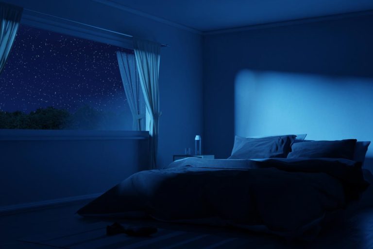 A bedroom with cozy low bed at night, Should I Leave My Curtains Open At Night?
