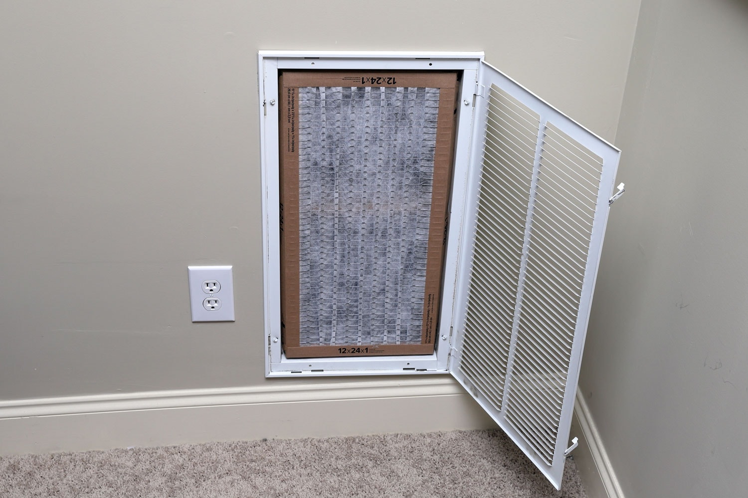Central AC system air filter in need of replacement due to dirt accumulation