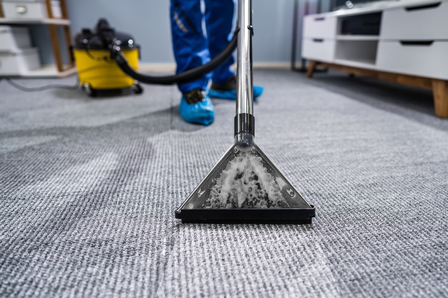 Cleaning carpet using a high-powered vacuum