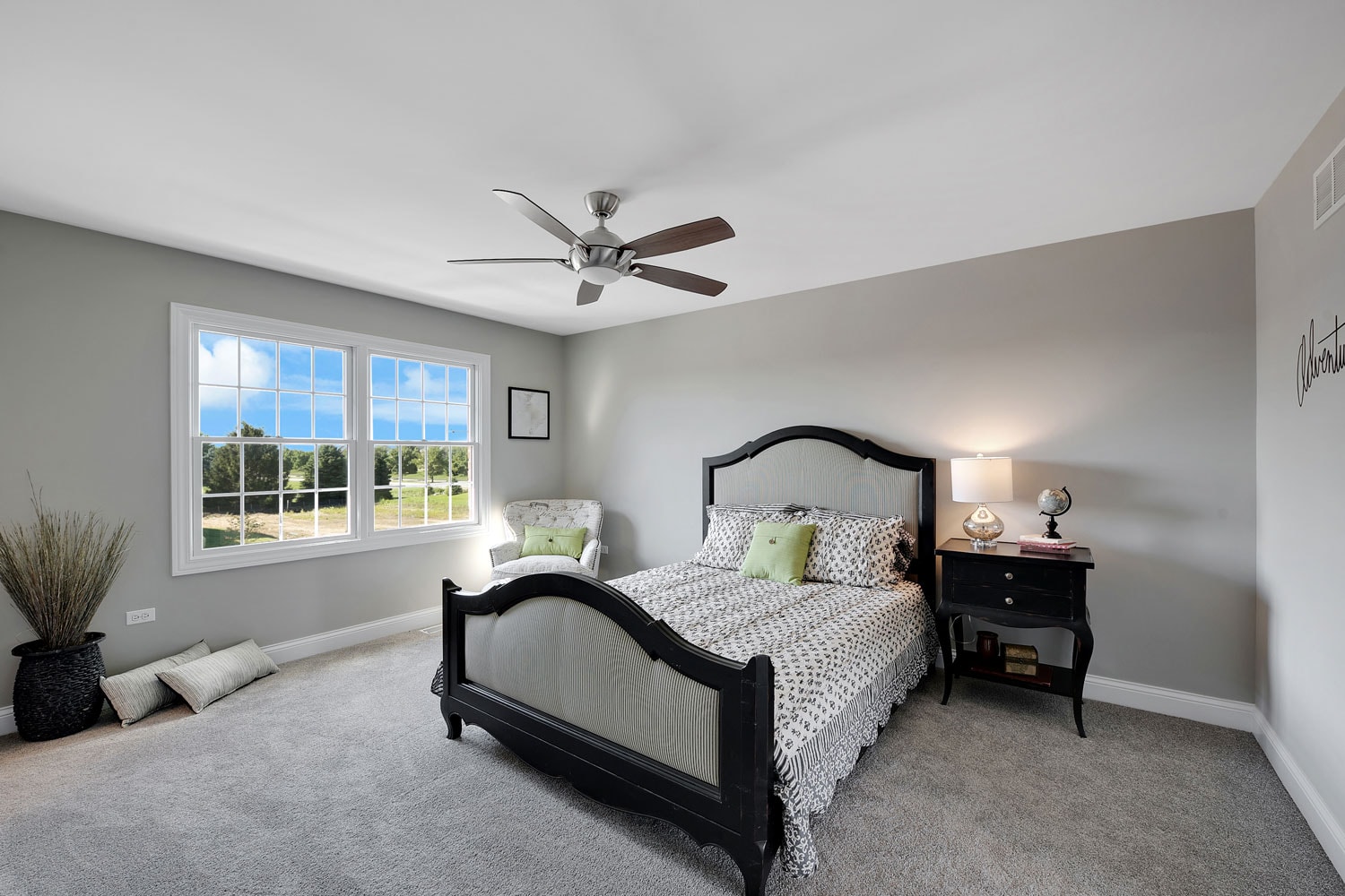 Gray and white inspired bedroom with a ceiling fan, black modern designed bed with black and white beddings