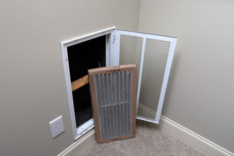 Removing Dirty Air filter for home central air conditioning system - How To Clean The Filter On Your Central AC