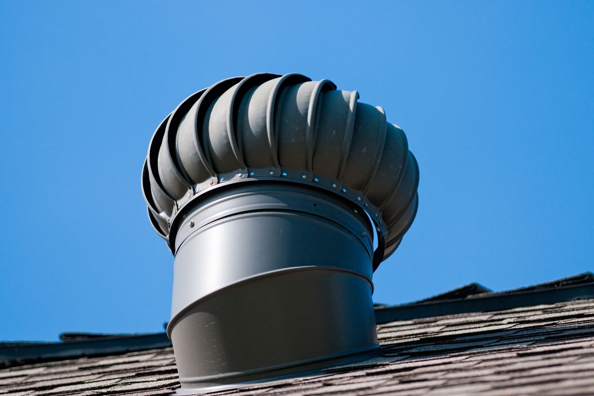 Roof top whirly bird ventilation on top of house