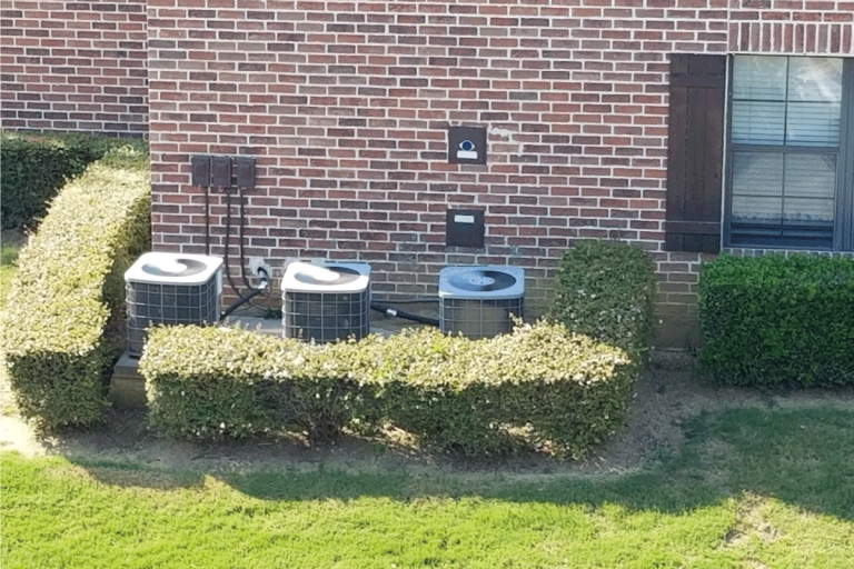Three air conditioning units in an apartment complex. How Old Is My Heil Air Conditioner