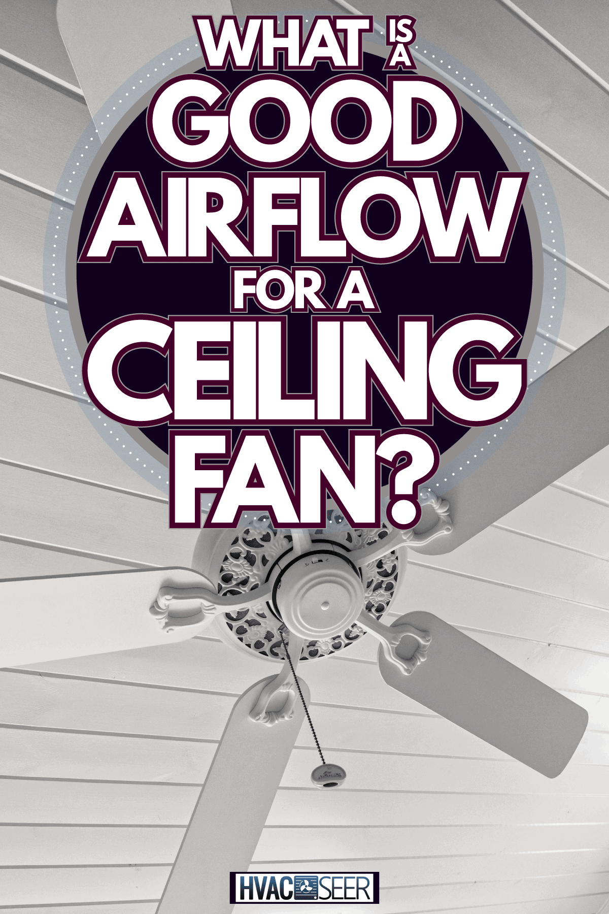 A white classic ceiling fan inside a white living room, What Is A Good Airflow For A Ceiling Fan?