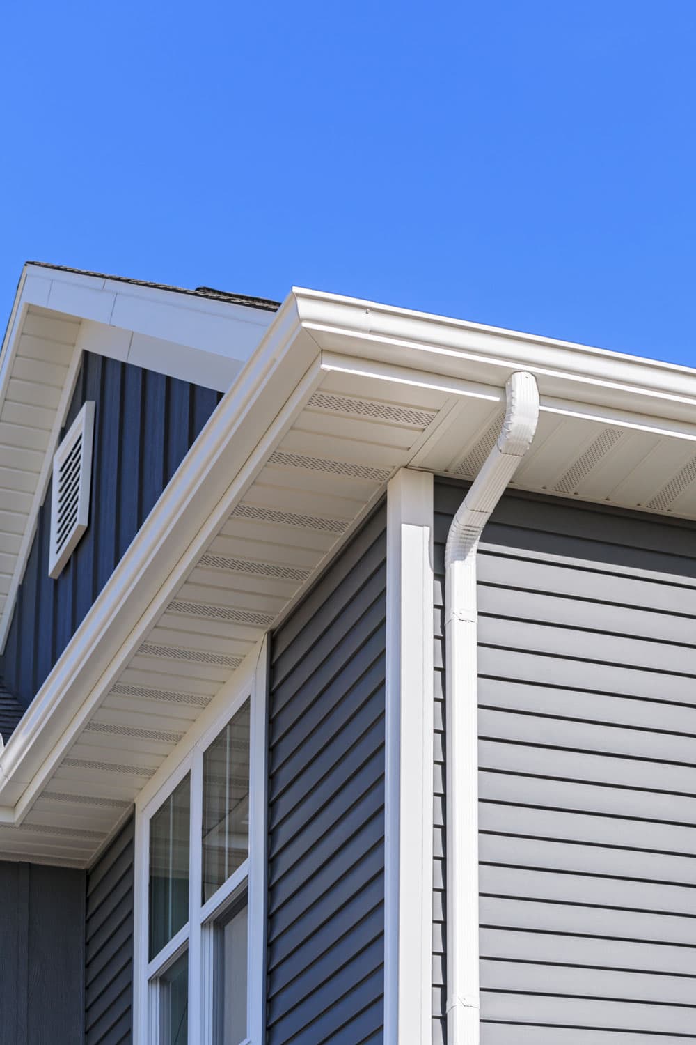 White aluminum soffit board of a two story house