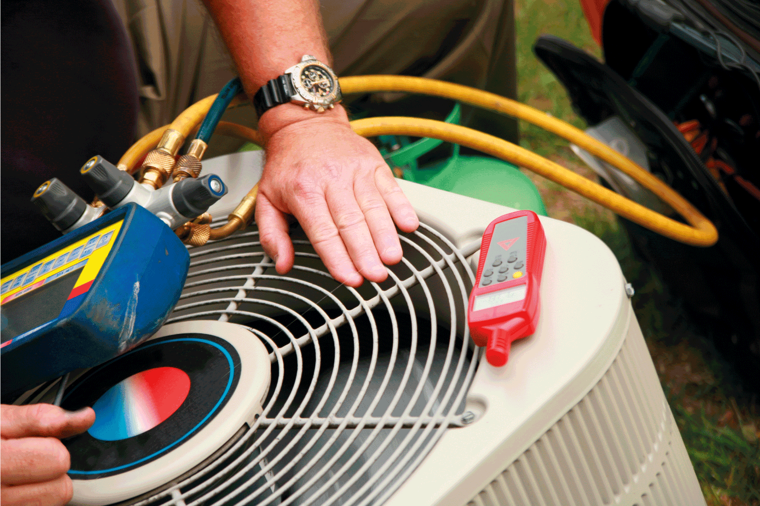 air conditioner service technician with gadgets repairing device