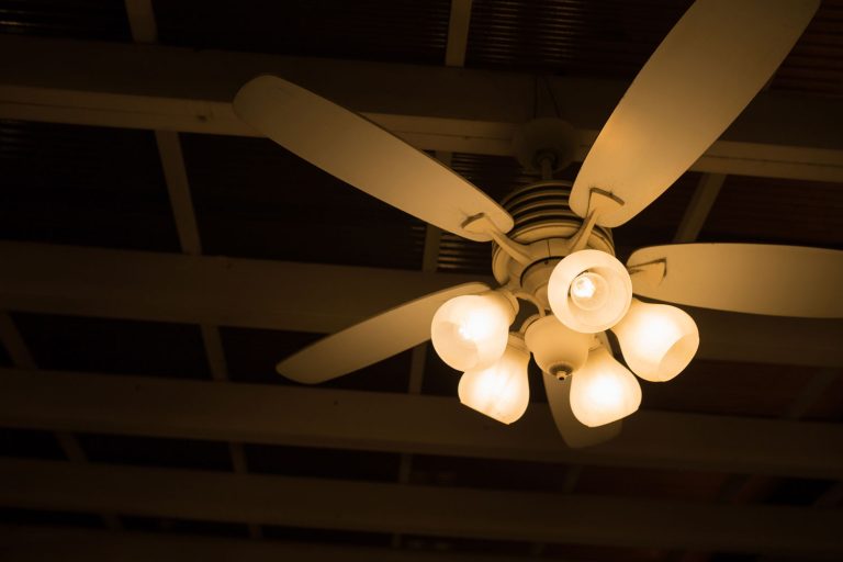 A dark room and ceiling fan lights turned on, How To Fix a Ceiling Fan Light