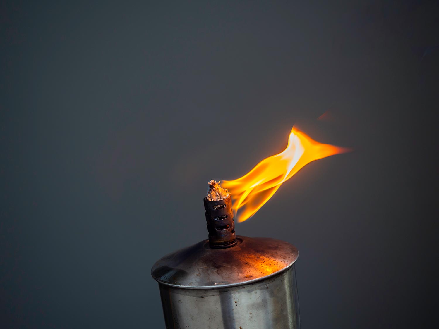 A garden torch flame on dark background