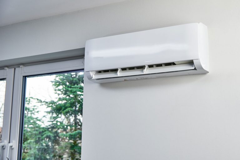 A mini split AC mounted on a white wall, Can AC Run Without Water?