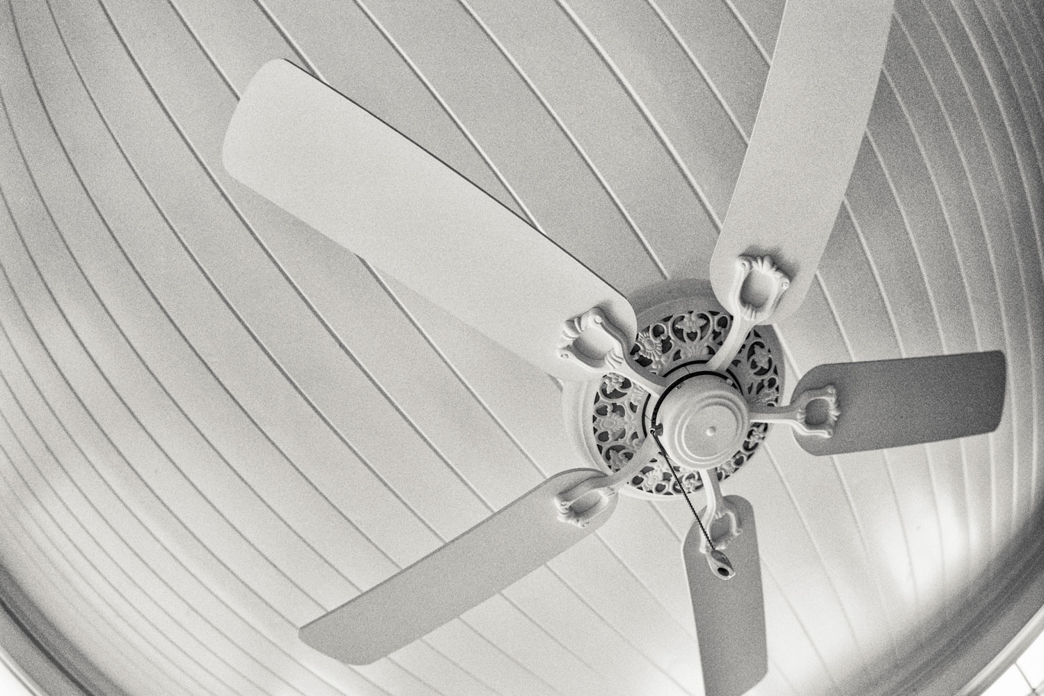 A white ceiling fan inside a modern living room