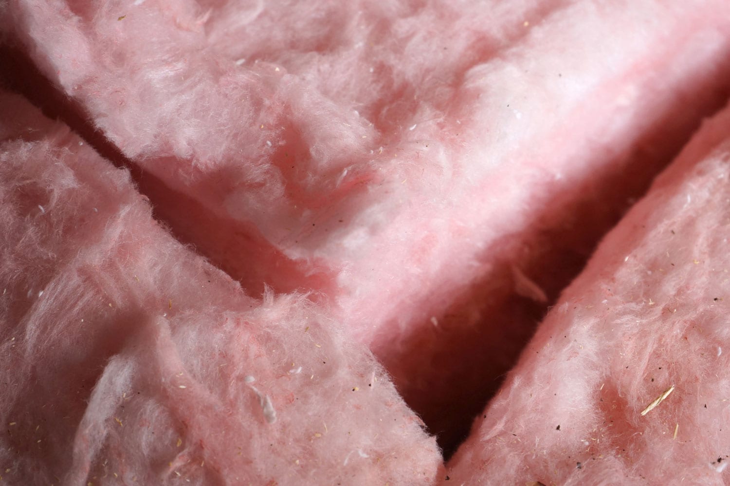 An up close photo of fiberglass insulation