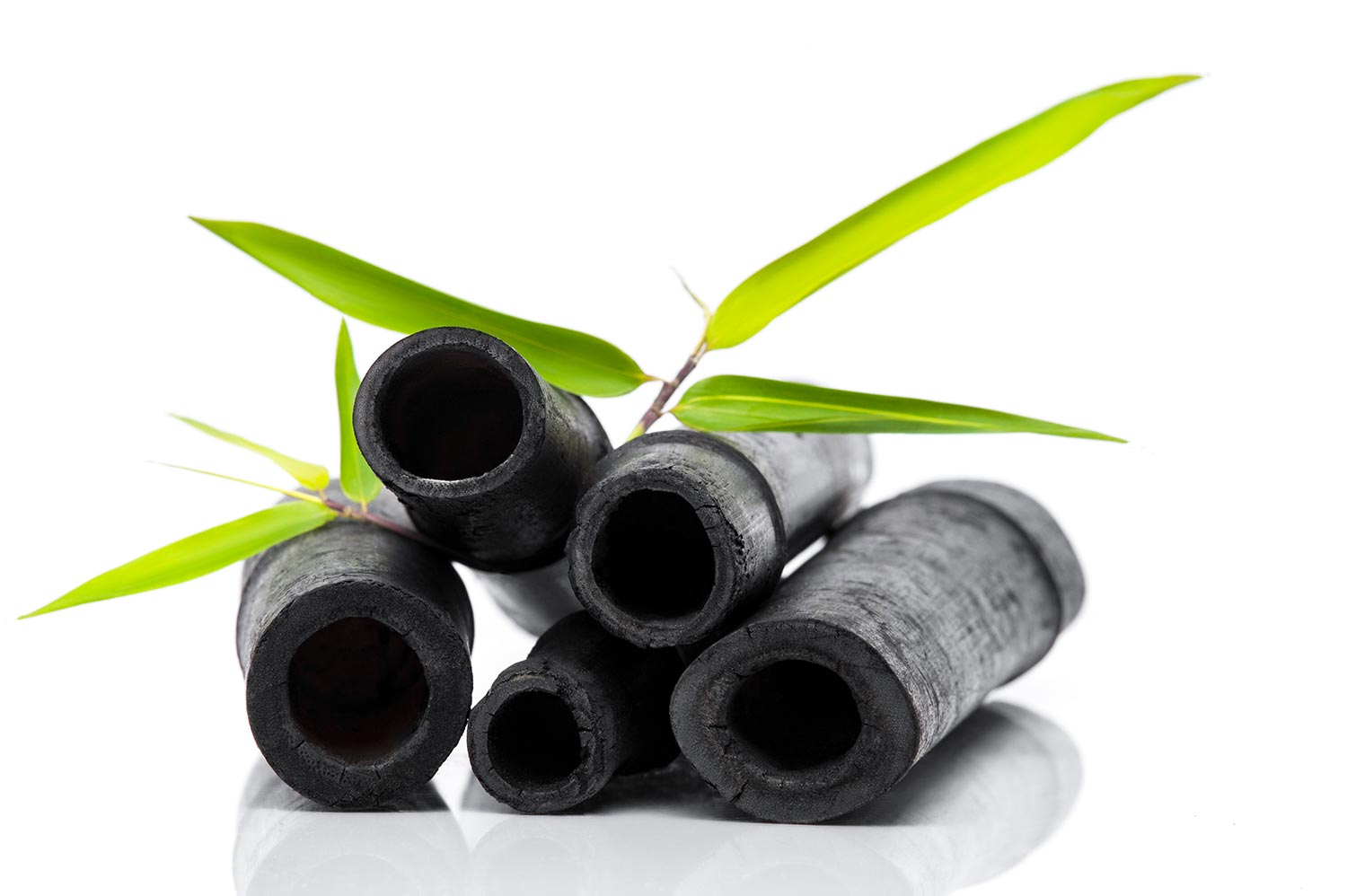 Bamboo charcoal water filter sticks and green leaf