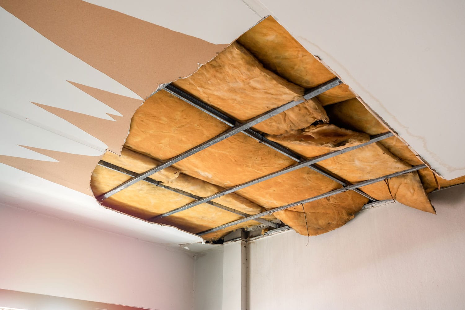 Damage ceiling showing the thermal insulation in the ceiling