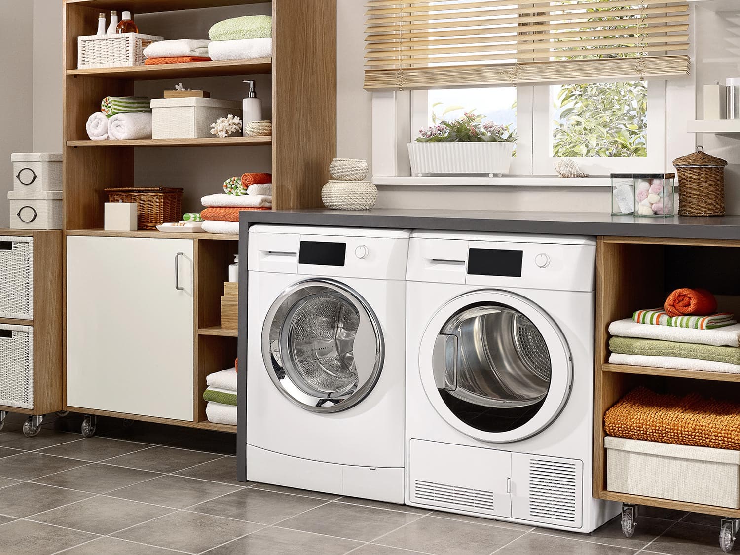 Domestic laundry room with washing machine and dryer
