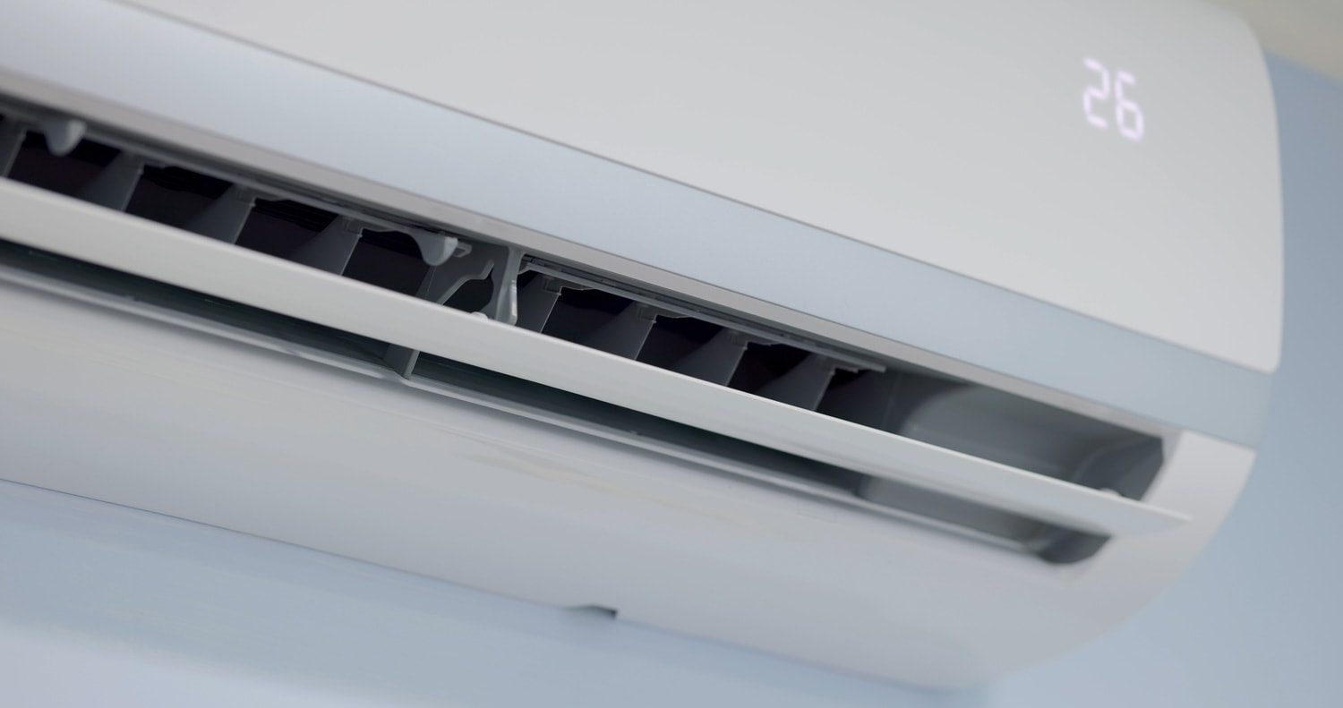 Energy Efficient concept - Close up shot of split type air conditioner on the wall