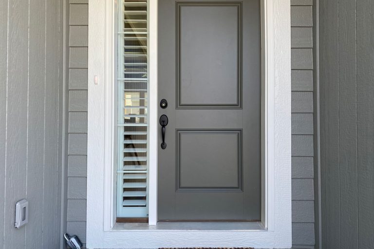 Gray front door with white trims and window panes with blinds, How To Seal Door Threshold To Concrete