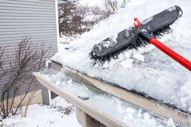 A gutters with ice dam and broom for raking snow off of a roof, How To Protect Gutters From Snow And Ice