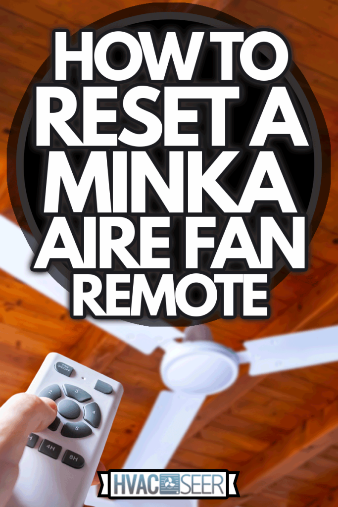 A person using a remote control to operate a ceiling fan mounted in a house on a wooden ceiling, How To Reset Minka Aire Fan Remote