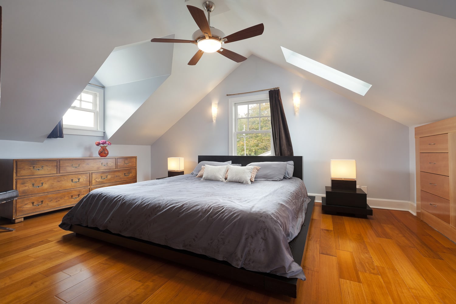 Master bedroom in large attic space.