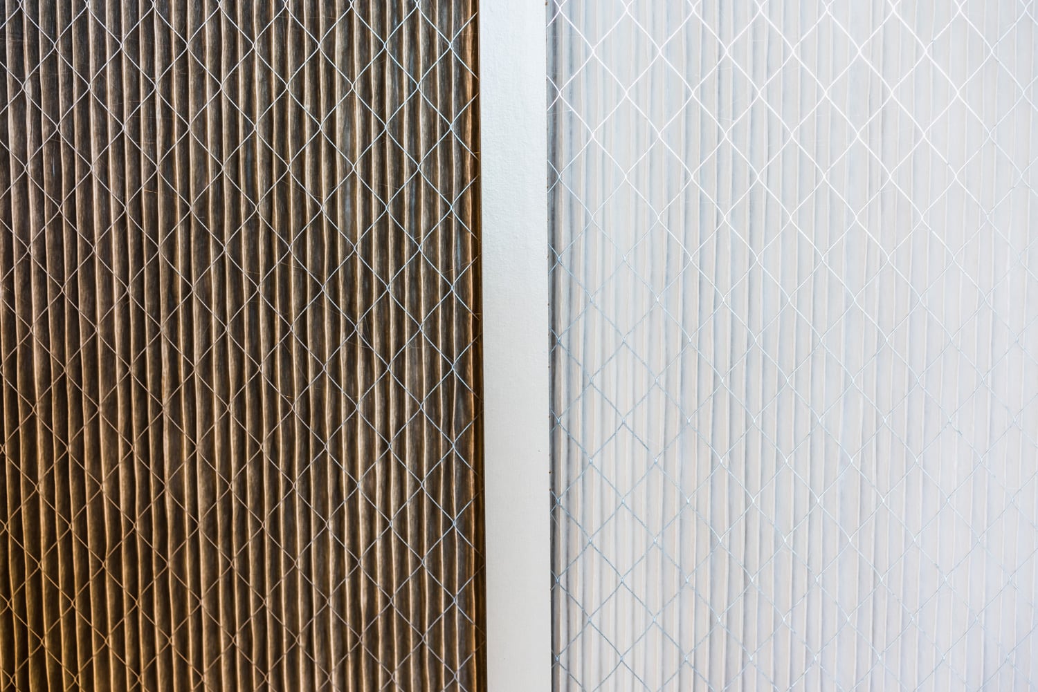 Side by side comparison of a dirty home air filter next to a clean white one; Filter replacement will maintain a good indoor air quality