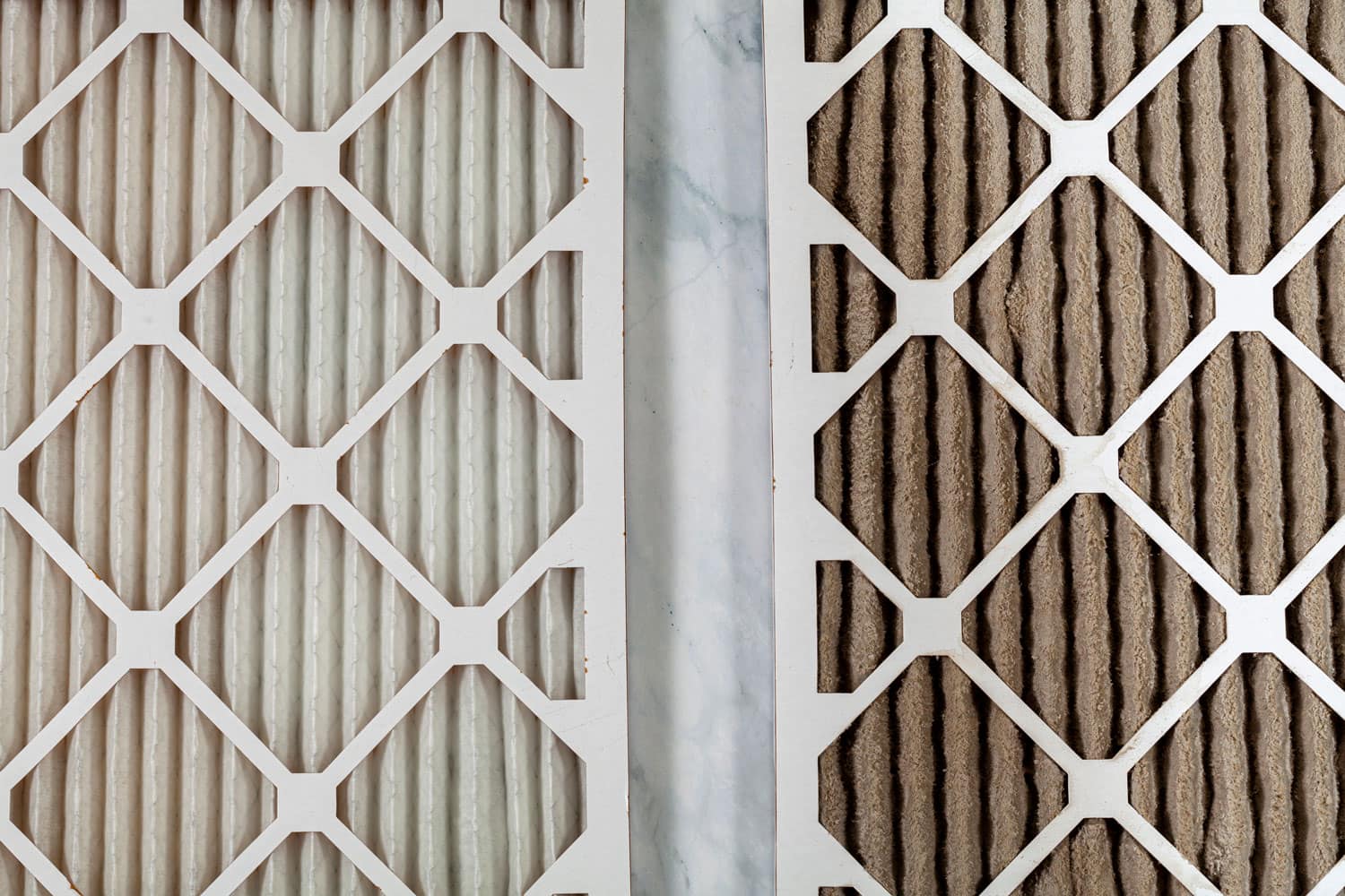 Two furnace air filters comparison of new and used