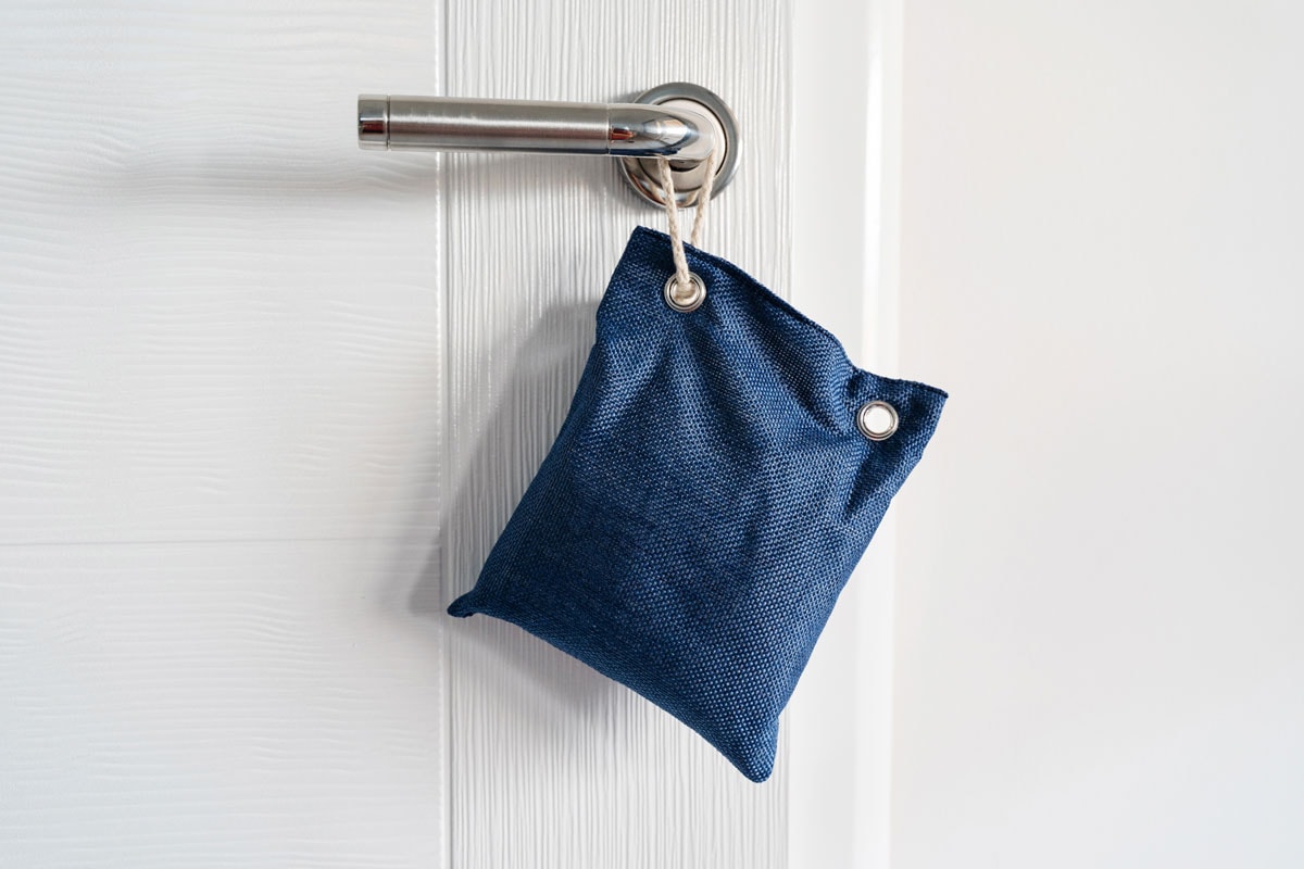 a bag of air purifier hanging in an entrance of a door