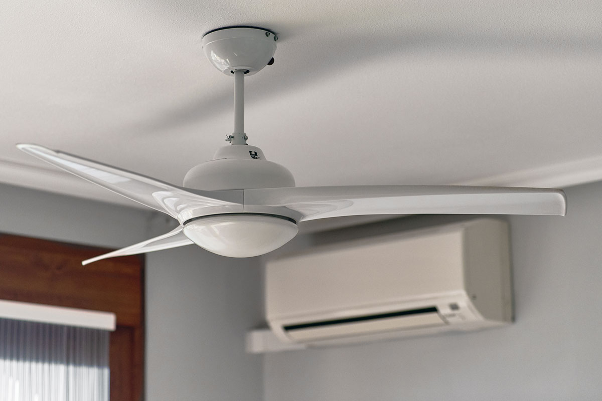 A Large white ceiling fan with three blades