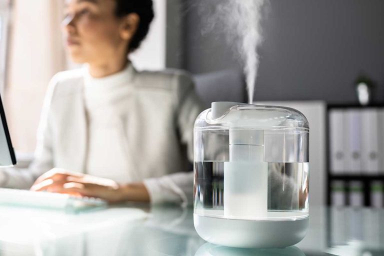 A woman in office with air humidifier, Can You Use Tap Water In A Humidifier?